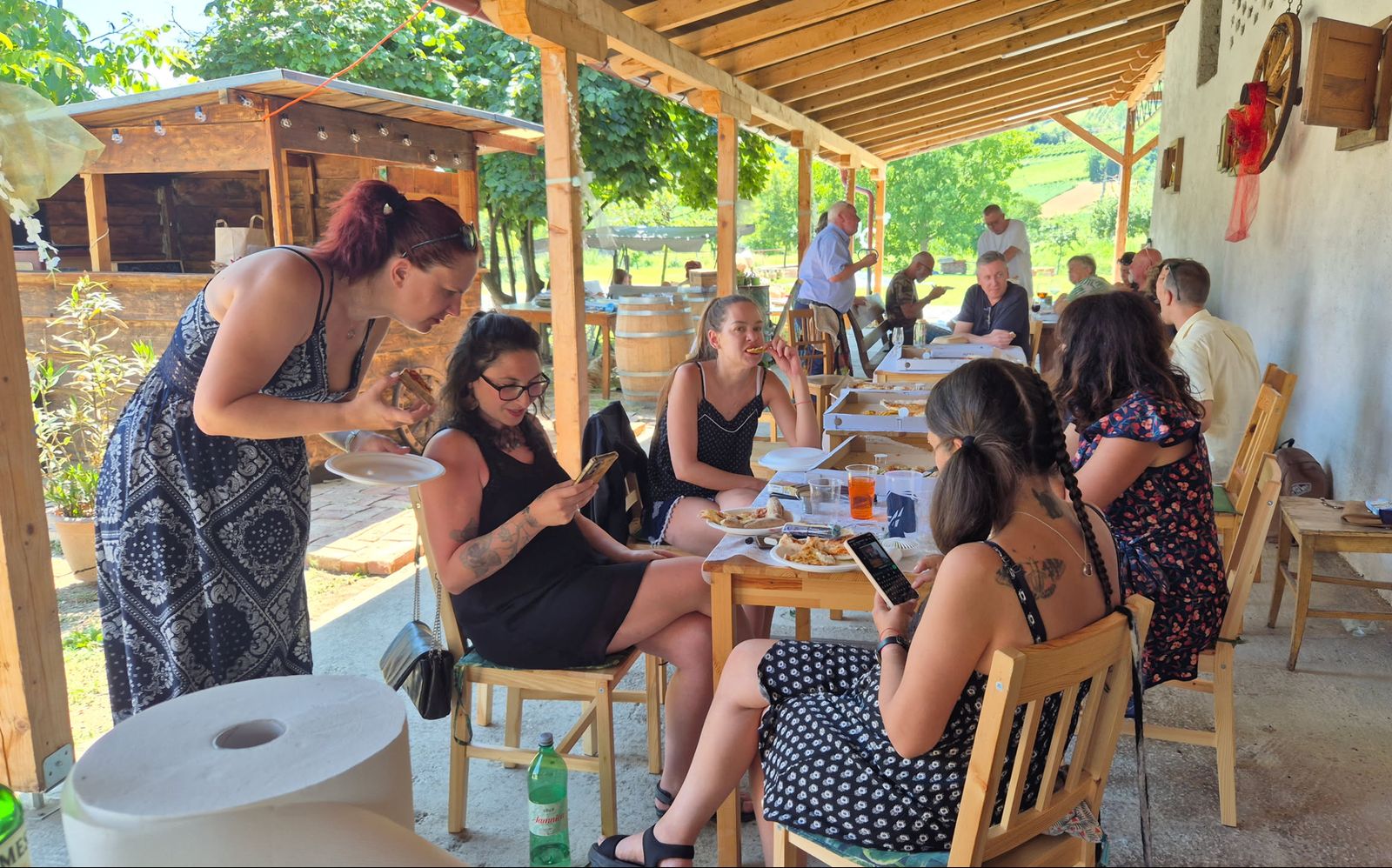 The barn today: guests at the tables on the covered tasting terrace